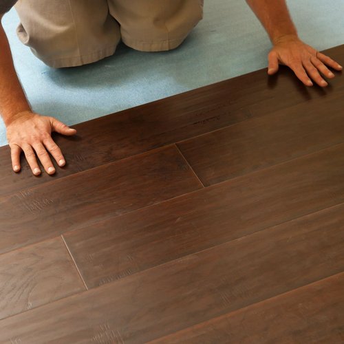 Person installing hardwood flooring from Rugtex of Florida in Miami, FL