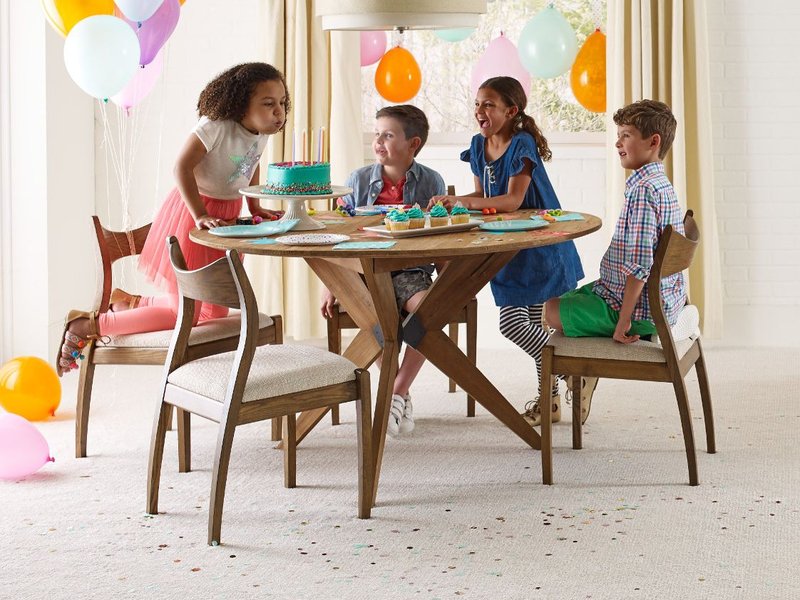 Kids playing around a table in a room with white carpet from Rugtex of Florida in Miami, FL